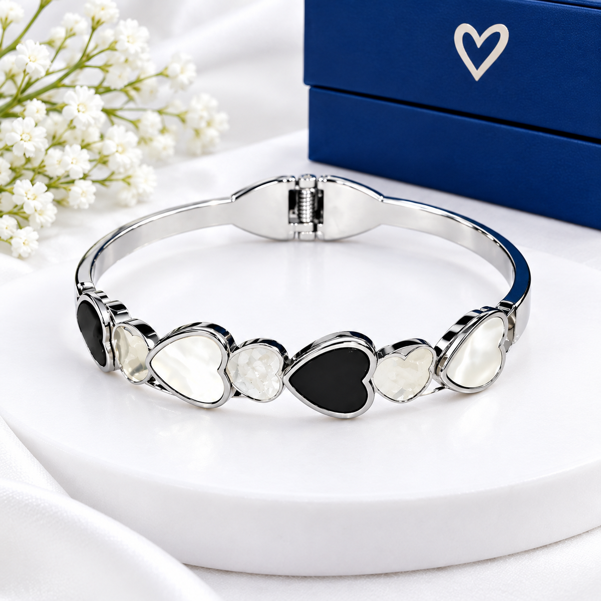 Silver heart link bracelet for women with black and white heart charms
